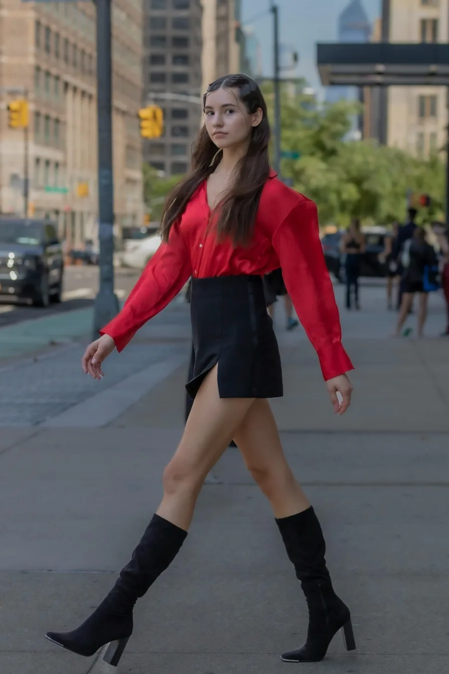 Red blouse and black mini skirt with knee boots